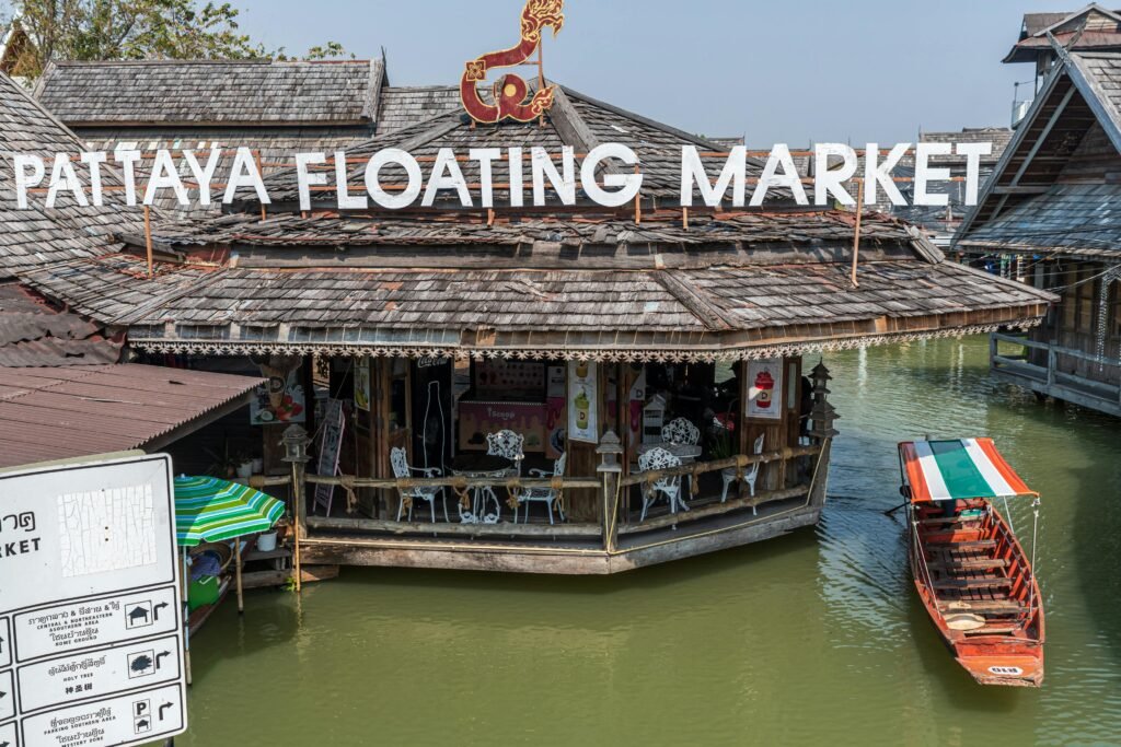 Historic Pattaya Floating Market featuring traditional Thai architecture and colorful boats.