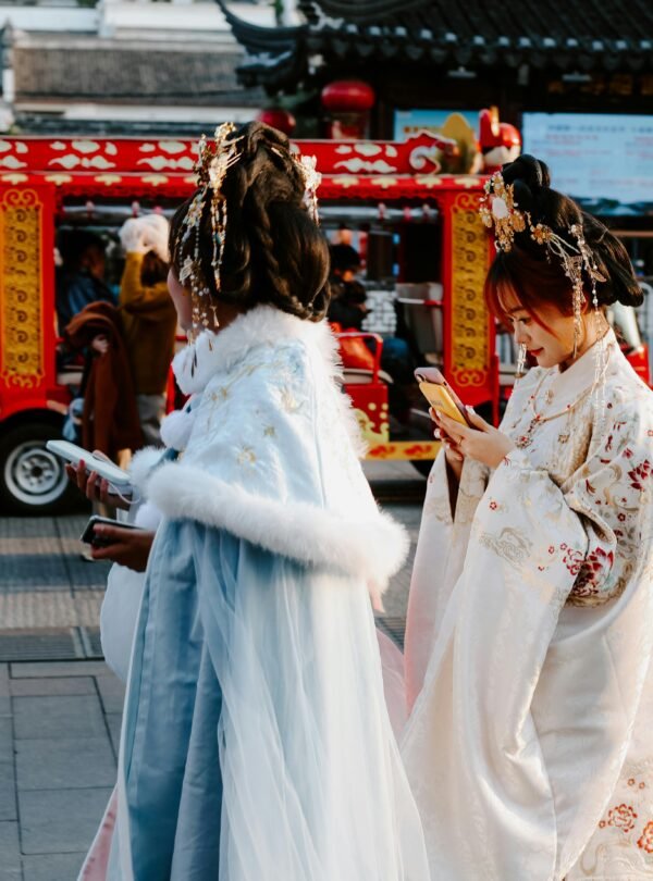 People in traditional attire on a vibrant street in Nanjing, capturing a moment of Chinese culture.