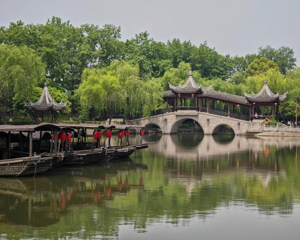 Captivating scene featuring traditional Chinese architecture reflected on a tranquil waterway in Jiaxing.