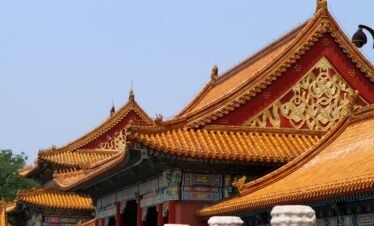Explore the stunning architecture of the Forbidden City with its vibrant roofs and intricate designs.