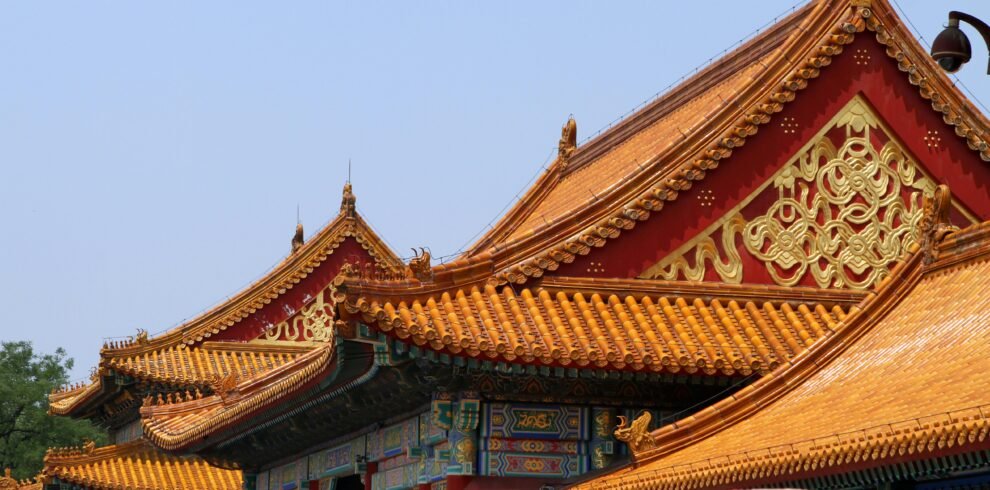 Explore the stunning architecture of the Forbidden City with its vibrant roofs and intricate designs.