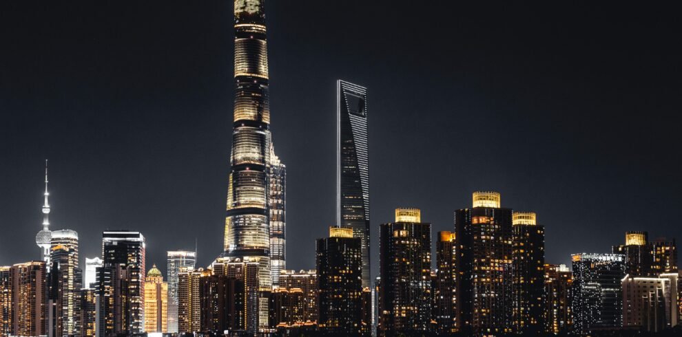 Shanghai skyline illuminated against the night sky featuring iconic skyscrapers.