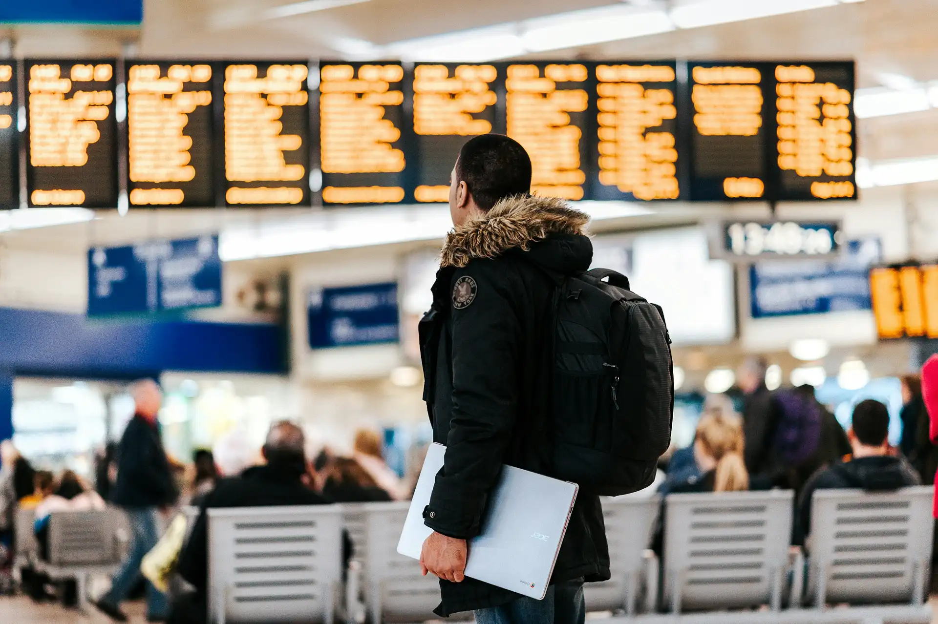 Indian traveller standing in an airport terminal, representing visa-free travel destinations available for Indians in 2026.