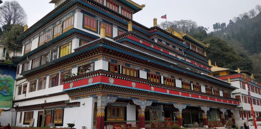 Beautiful Dali Monastery exterior in foggy Darjeeling, India with vibrant architecture.