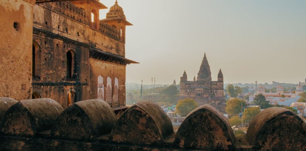Captivating view of Orchha's ancient temples and fort, showcasing Rajput architecture at sunrise in Madhya Pradesh, India.