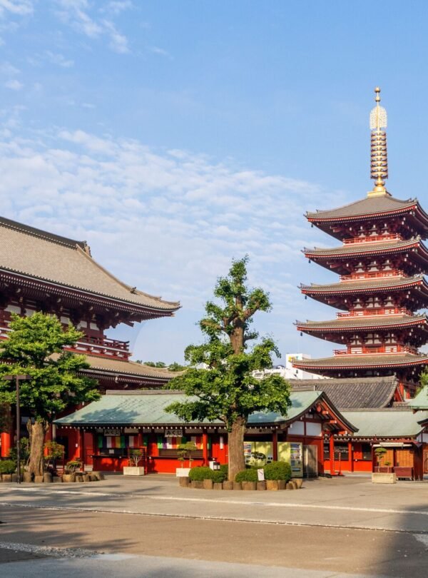 Sunny view of Senso-ji Temple and Five-Storied Pagoda in Tokyo, showcasing traditional Japanese architecture.