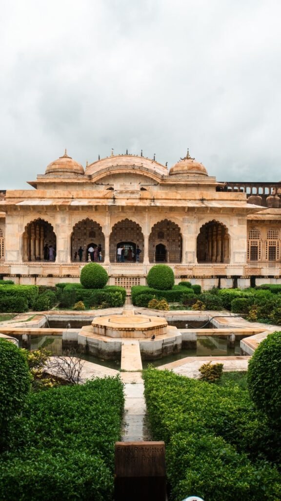 Beautiful garden view of historic architecture in Jaipur, India showcasing traditional design.
