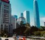 A vibrant view of Hong Kong's Central District showcasing iconic skyscrapers and city life.