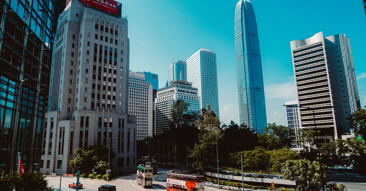 A vibrant view of Hong Kong's Central District showcasing iconic skyscrapers and city life.