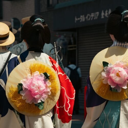 Traditional festival in Tokyo featuring kimonos and floral designs.