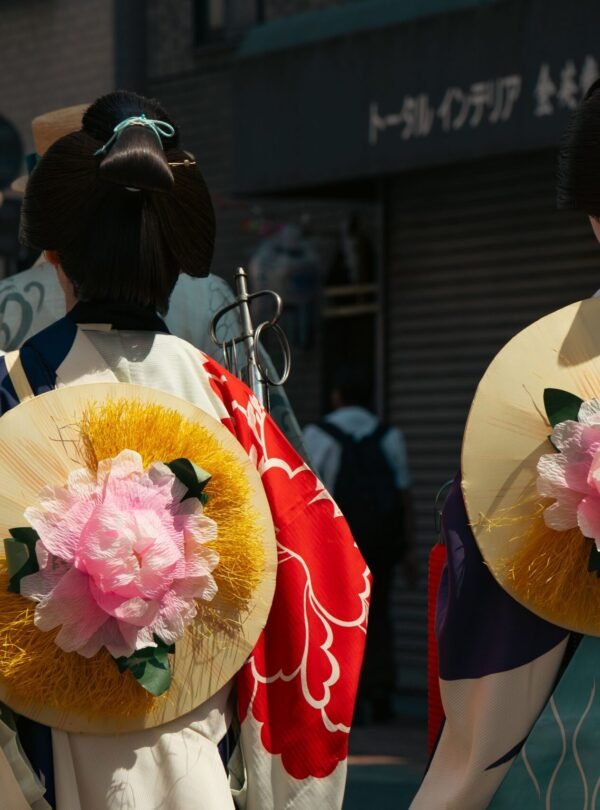 Traditional festival in Tokyo featuring kimonos and floral designs.