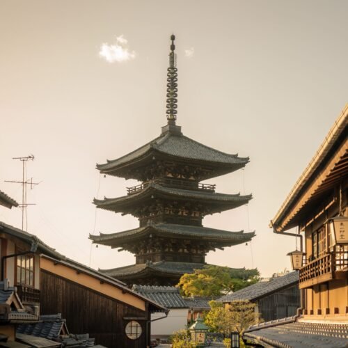 Scenic view of Yasaka Pagoda surrounded by traditional Kyoto architecture at sunset.