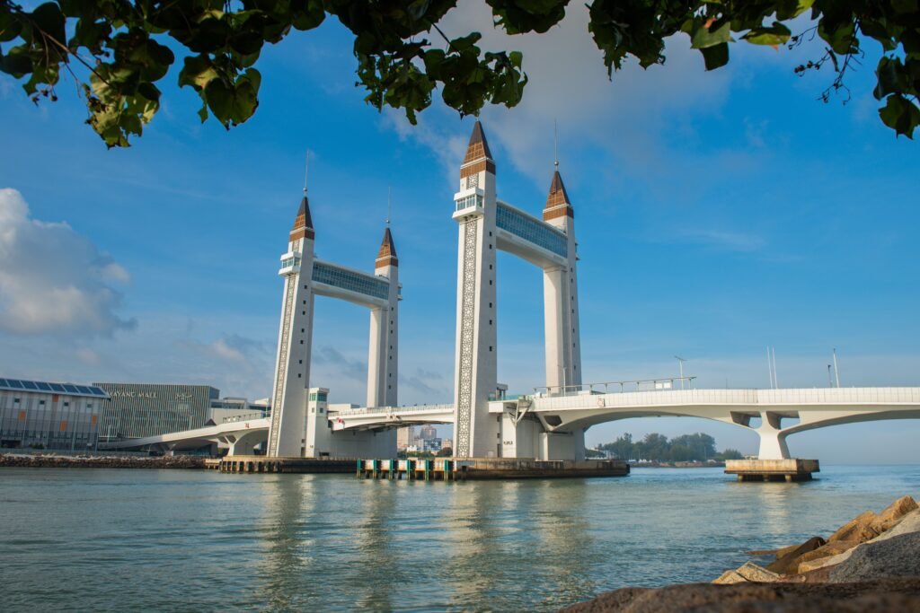 Capture of Terengganu's iconic drawbridge with clear blue skies and calm waters.