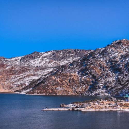 Scenic view of snow-covered mountains and lake in Gangtok, India. Perfect for nature lovers.